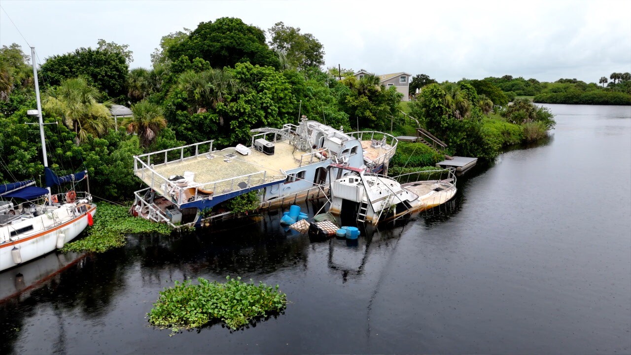 Abandoned, half-sunk boats in the Glades RV Park Marina.