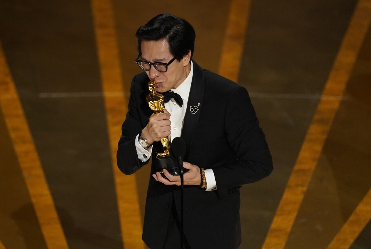 Ke Huy Quan kisses Oscar statuette as he accepts award for best supporting actor for 'Everything Everywhere All at Once' at Oscars, March 12, 2023