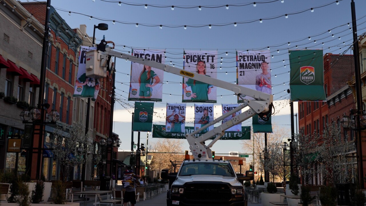 putting up the flags for Summit FC.jpg