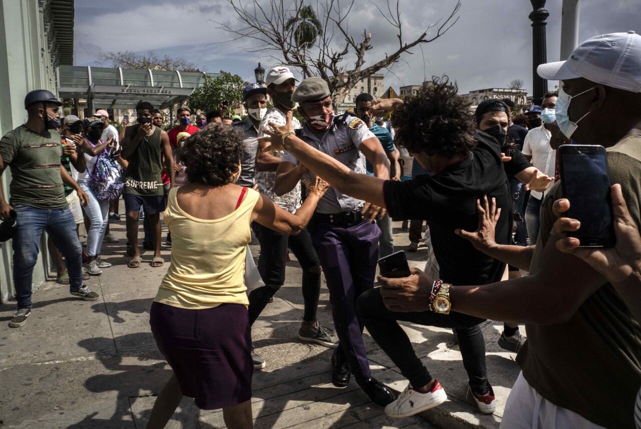 Police scuffle with anti-government demonstrator in Havana, Cuba, July 11, 2021