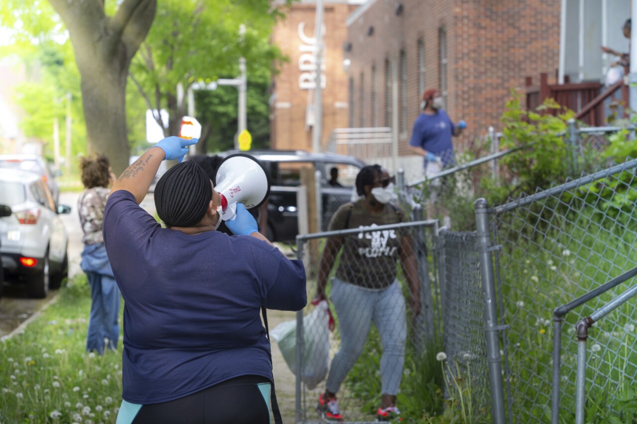 McCurtis asks neighbors what they need. Photo credit: Dan Herda, United Way