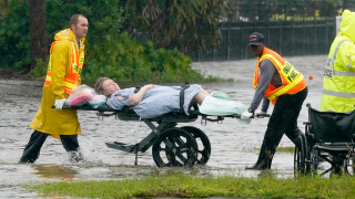 Authorities transport a person out of the Avante nursing home in the aftermath of Hurricane Ian