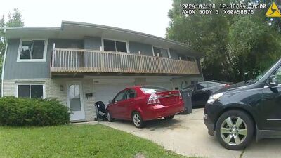 Waukesha father holds baby out of window