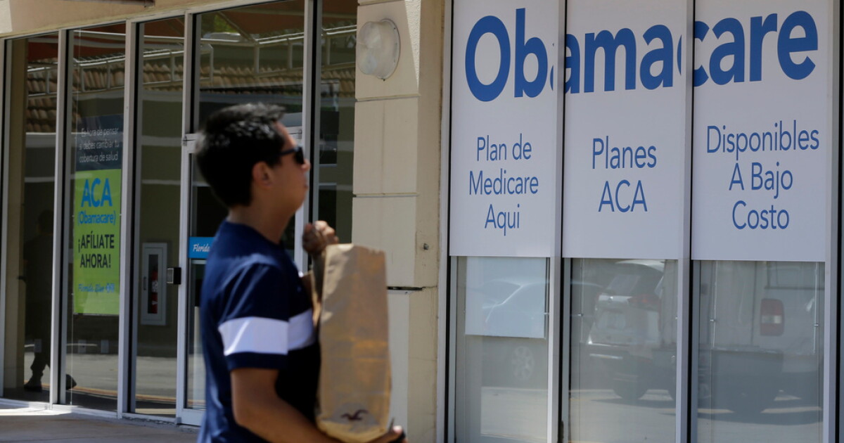 Photo: scrippsnews.com A man walks by an healthcare insurance office in Hialeah, Fla., July 27, 2017