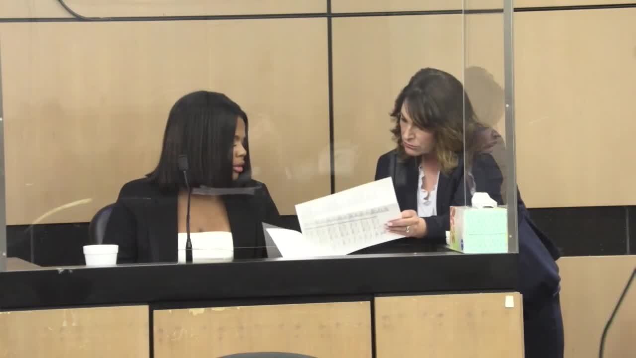 Defense attorney Heidi Perlet shows Dominique Jones transcript of statement on second day of testimony in Travis Rudolph murder trial, May 25, 2023