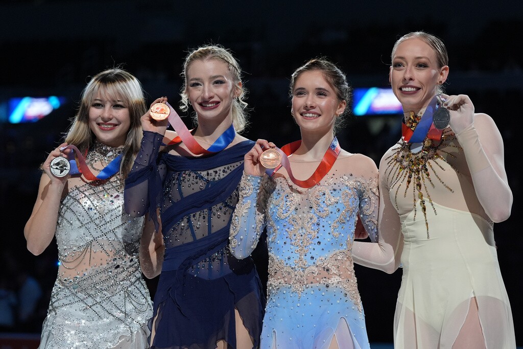 From left to right, silver medalist Alysa Liu, gold medalist Amber Glenn, bronze medalist Isabeau Levito and fourth place finisher Bradie Tennell pose with their medals after the women's free skating competition at the U.S. Figure Skating Championships, Friday, Jan. 9, 2026, in St. Louis.