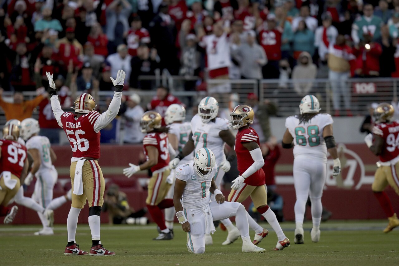 Miami Dolphins QB Tua Tagovailo kneels after fumble at San Francisco 49ers, Dec. 4, 2022