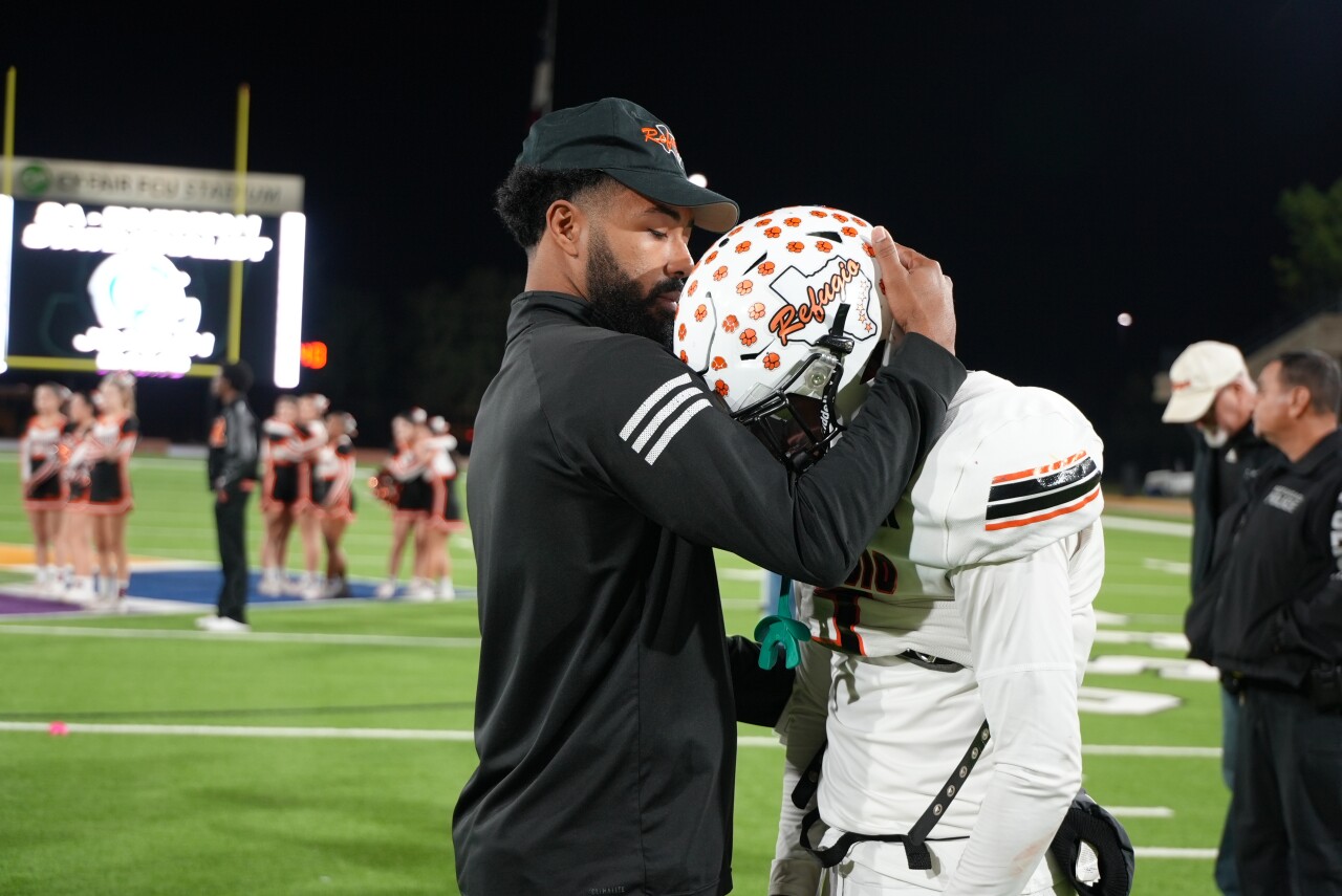 Refugio coach hugs Fabian Garcia after loss
