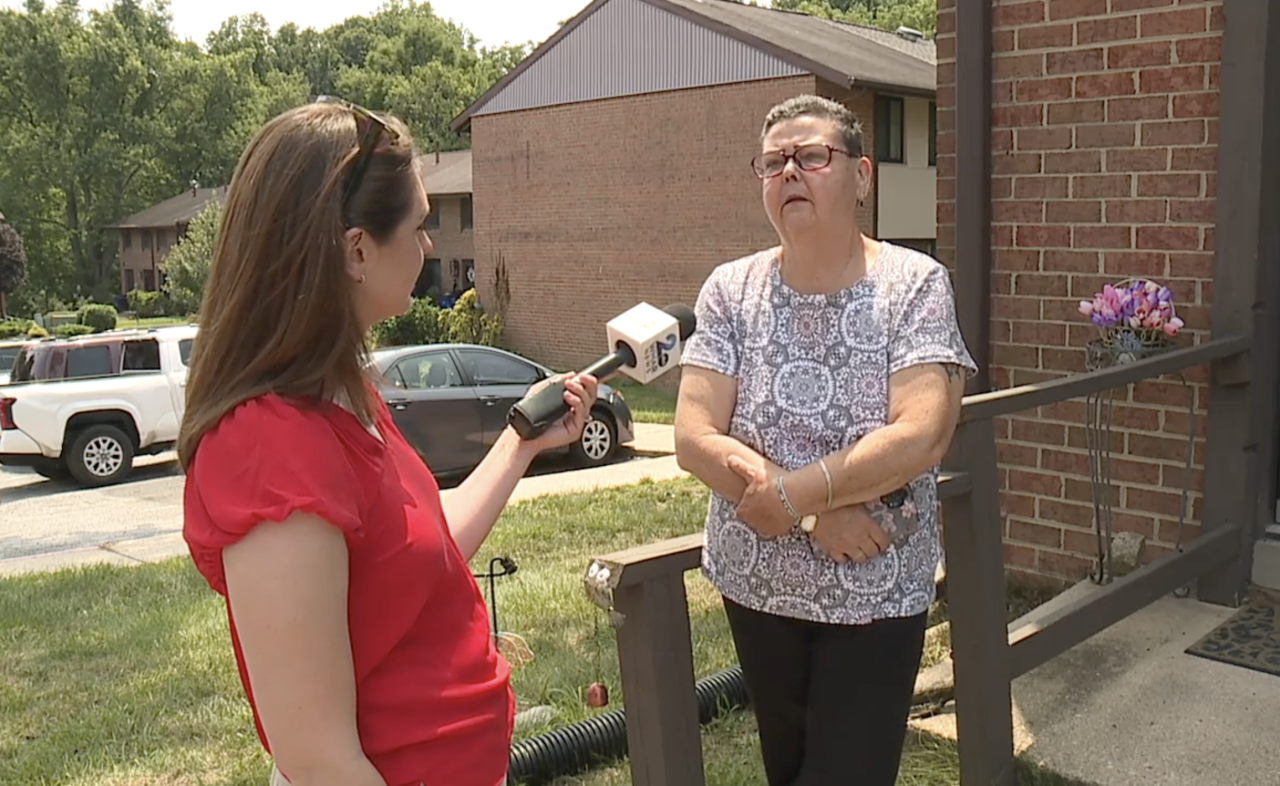 WMAR-2 News' Blair Sabol speaks to a neighbor in Columbia