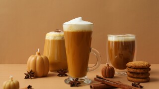 Pumpkin,Coffee,In,Glasses,,Spices,And,Candles,On,Beige,Background