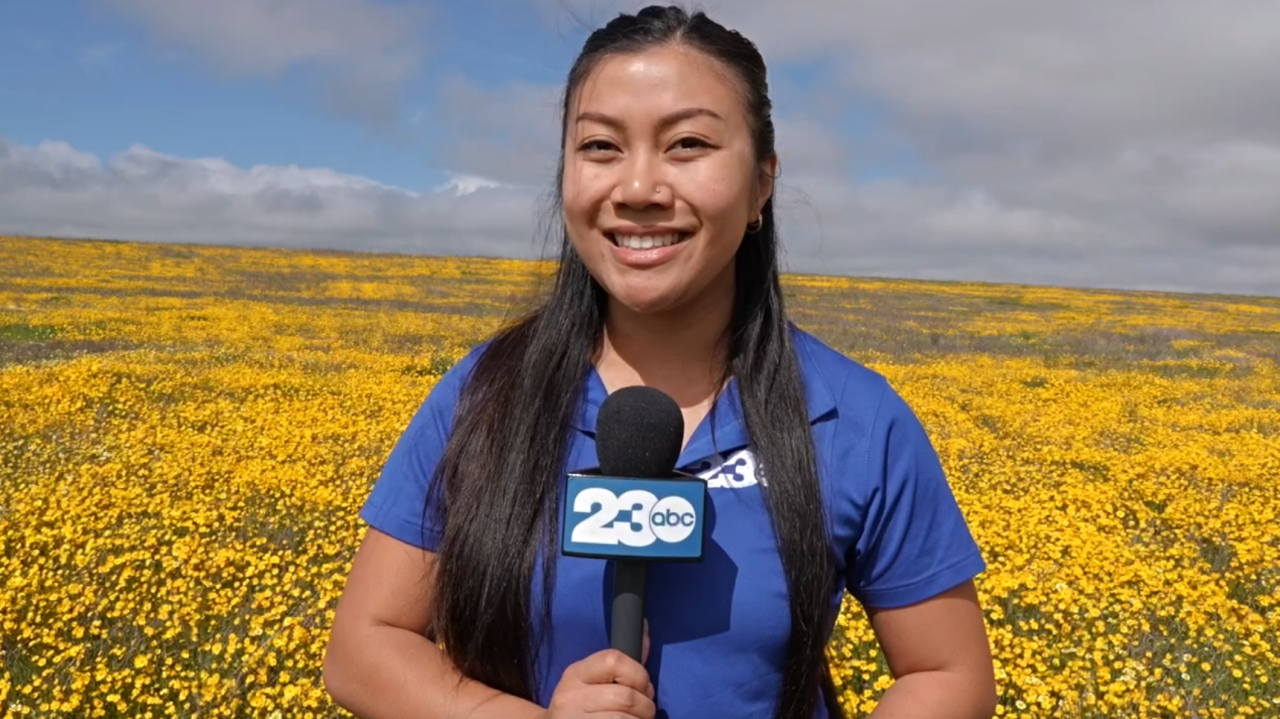 Neighborhood News Reporter Raquel Calo at the Carrizo Plain near Taft. This is just one of many spots full of vibrant wildflowers.