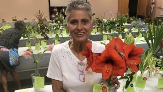 Debbie holding flowers. 
