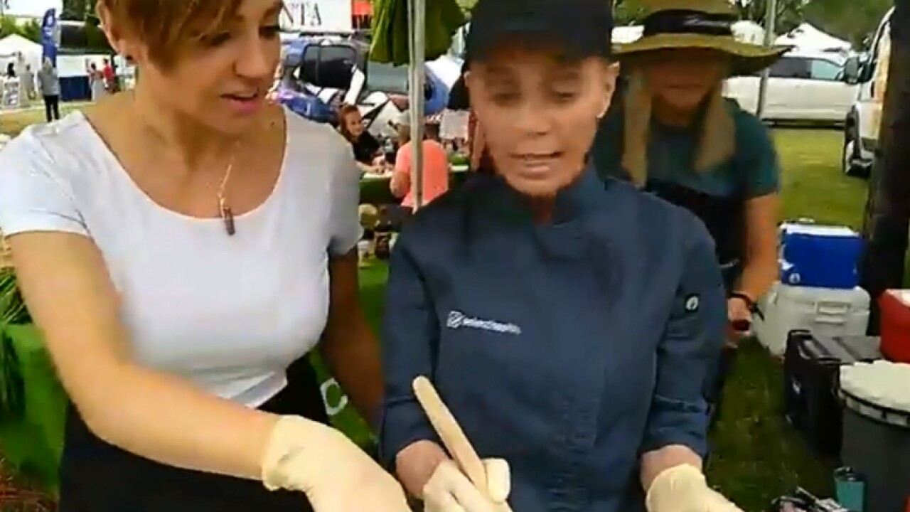 Making a healthy coleslaw at the Farmers Market SelectHealth tent