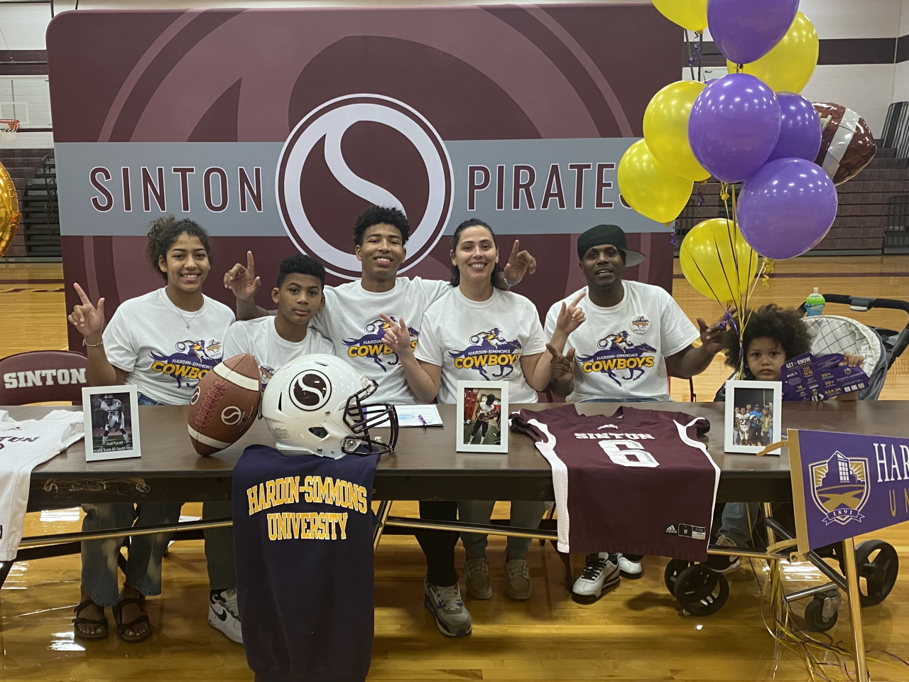 Mykha with his older brother Goddy on Sinton's college signing day