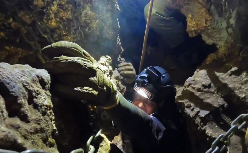 National Geographic Explorer-in-Residence and leader of the excavation expedition Dr. Lee Berger is shown inside the last reach-out of the chute labyrinth inside the Rising Star cave.