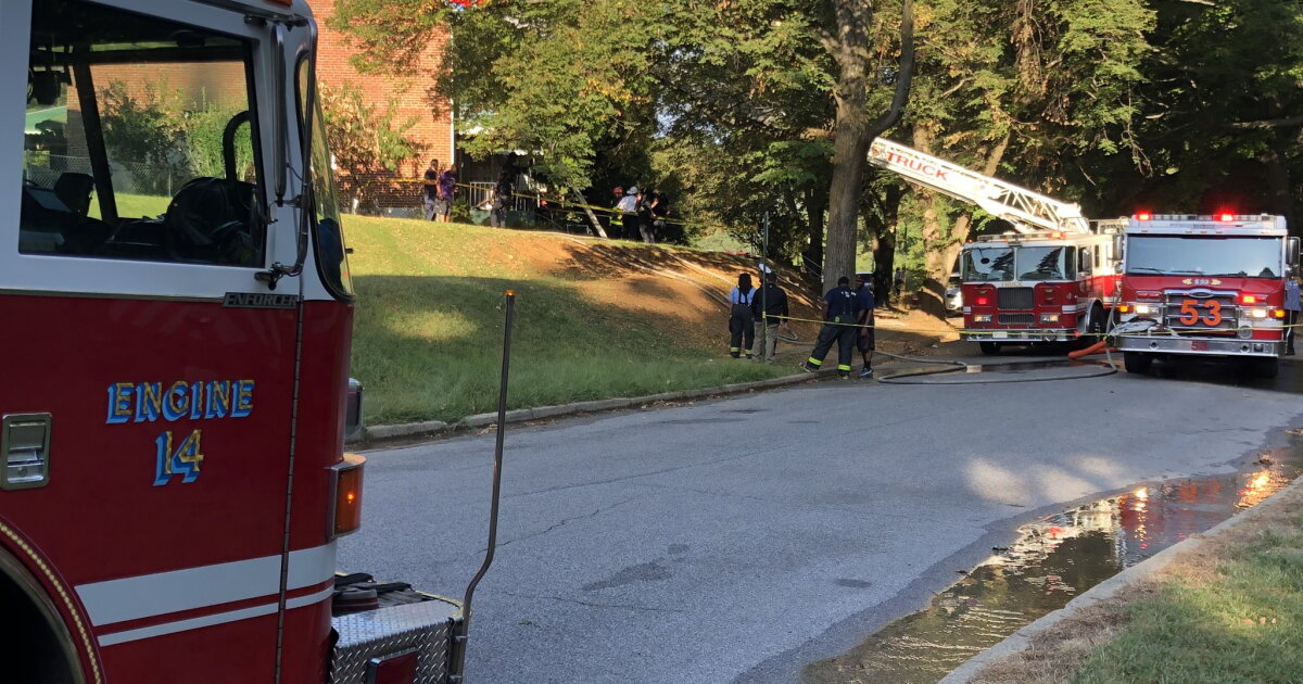 Woman dies after firefighters pull her from burning home