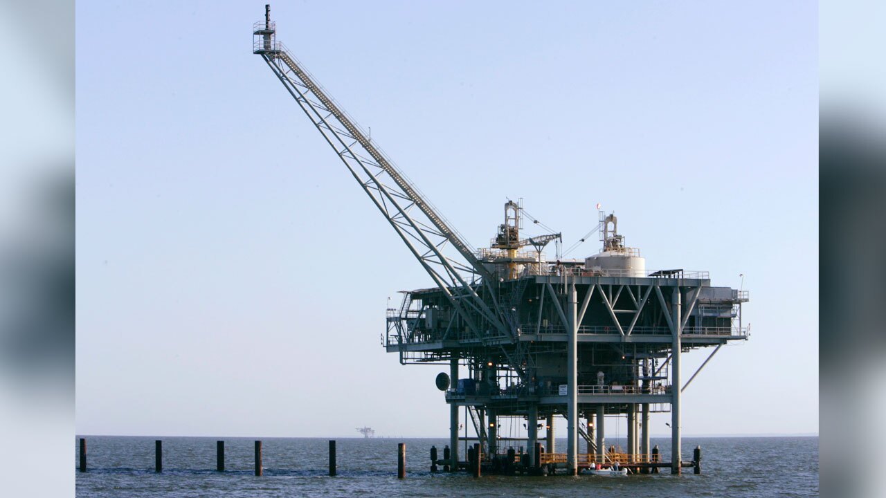 FILE - A natural gas platform is shown, April 13, 2006, off the coast of Fort Morgan, Ala. (AP Photo/Rob Carr, File)