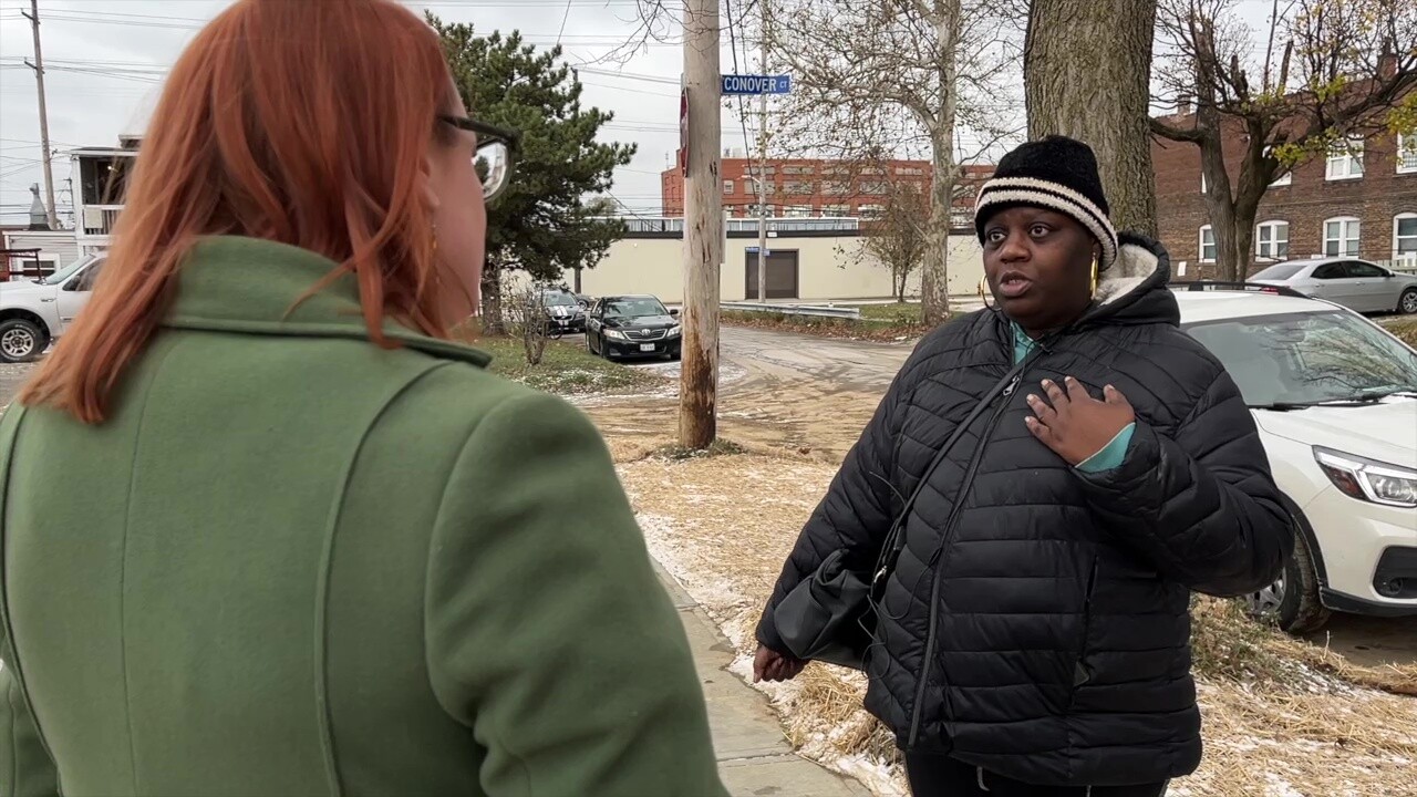 Tamika Herring talks to News 5 reporter Michelle Jarboe on Monday. She frequently passes the new modular homes in Cleveland's Detroit Shoreway neighborhood.