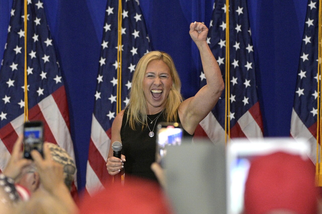 Marjorie Taylor Greene raises fist into air during 'America First' rally in Villages, May 7, 2021