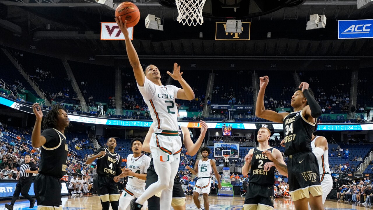 Miami guard Isaiah Wong (2) drives past Wake Forest guard Tyree Appleby (1) and forward Bobi Klintman (34) during the first half of an NCAA college basketball game at the Atlantic Coast Conference Tournament in Greensboro, N.C., Thursday, March 9, 2023.