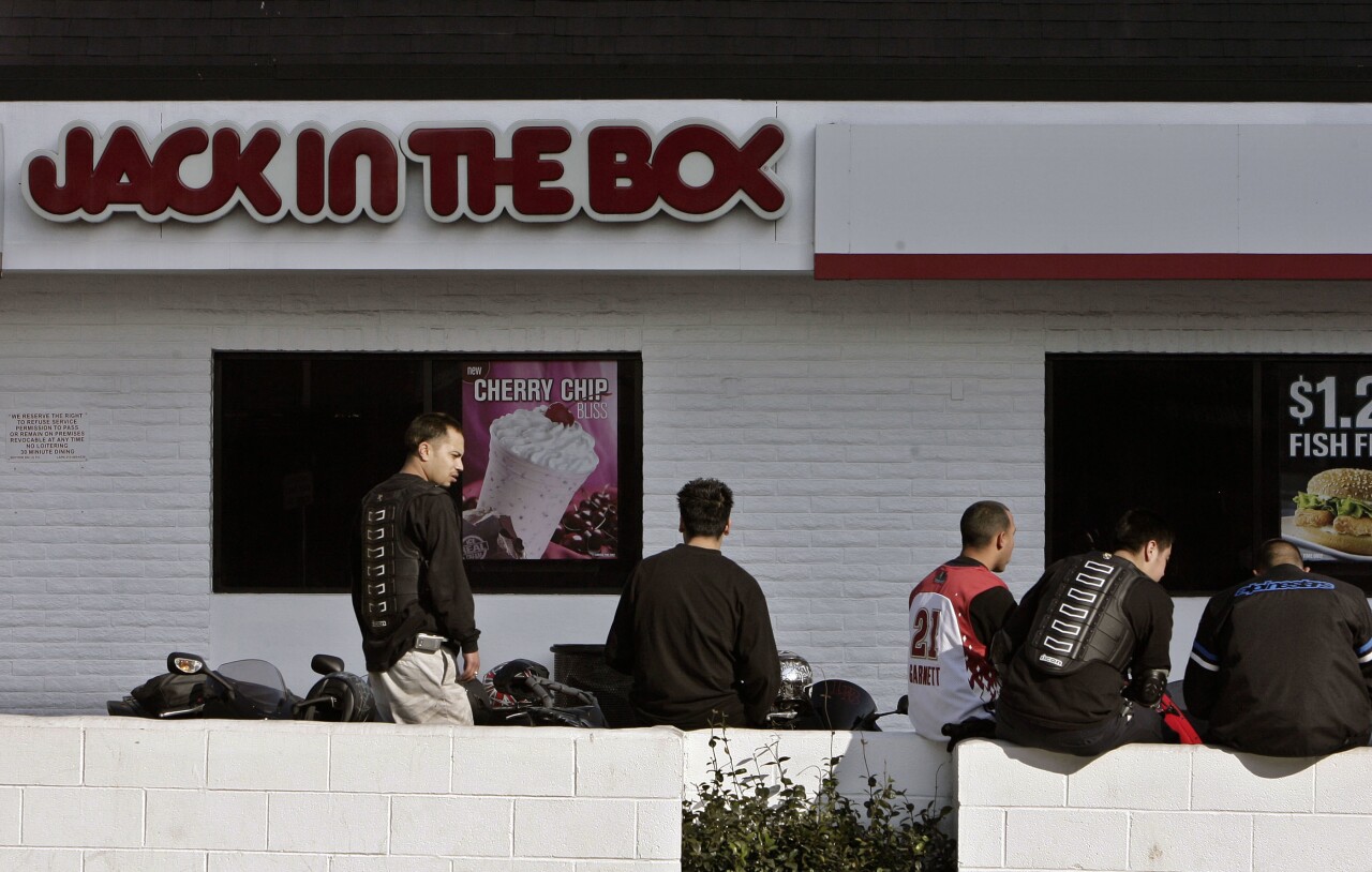 People wait outside Jack in the Box in Los Angeles in 2008
