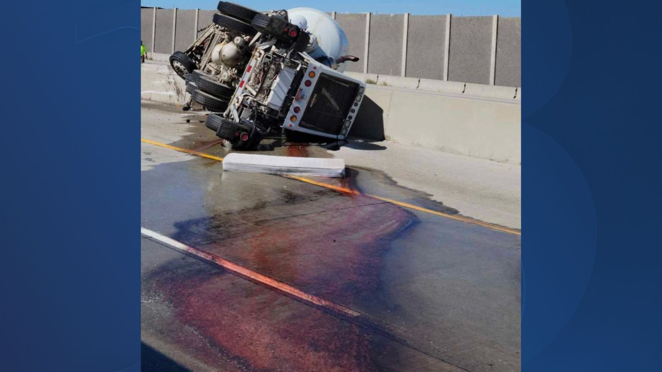 Large spill, cement truck rollover causes highway traffic headache