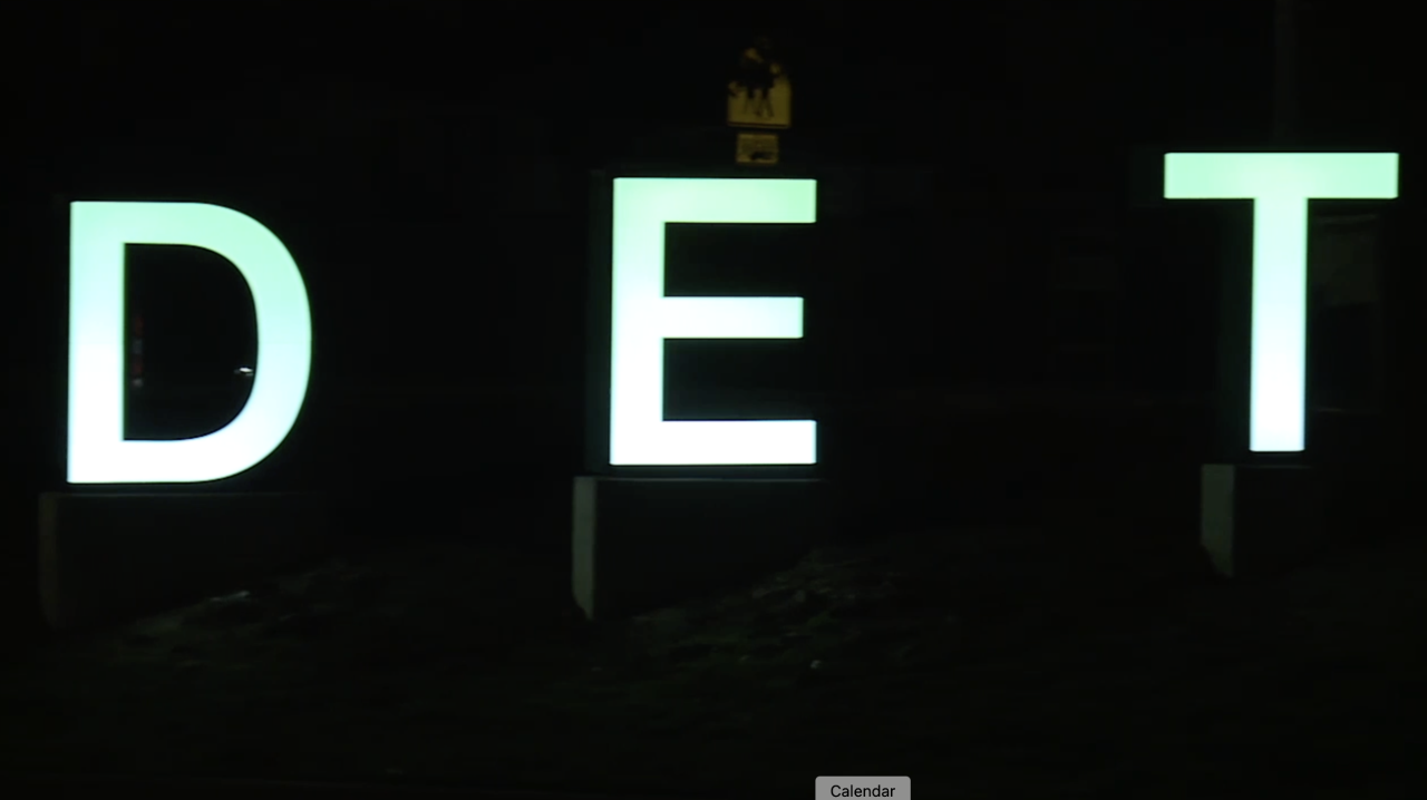 The Detroit sign along I-94 now lights up in the night
