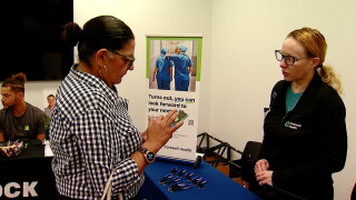 Dena at a booth.jpg