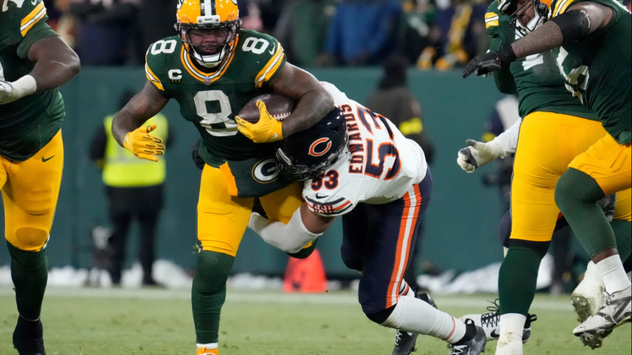 Chicago Bears linebacker T.J. Edwards (53) tackles Green Bay Packers running back Josh Jacobs (8) during the second half of an NFL football game Sunday, Dec. 7, 2025, in Green Bay.
