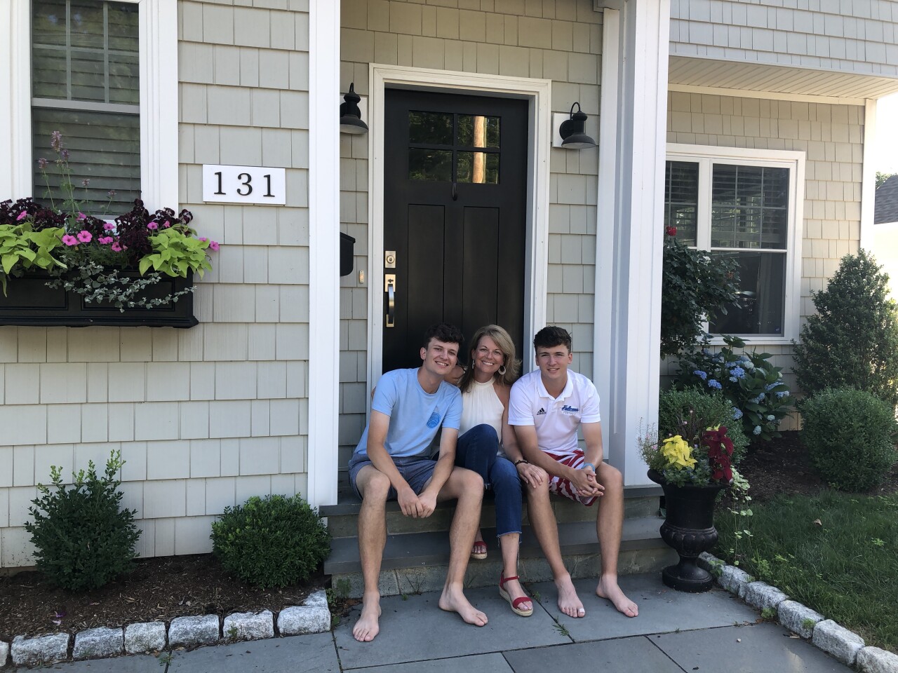 Sandra (middle) and her two sons, today.