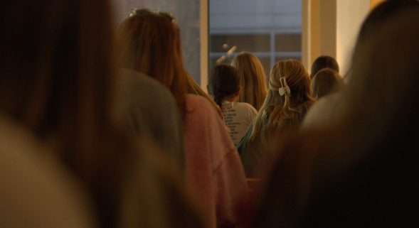 Students from St. James Academy High School pray the rosary