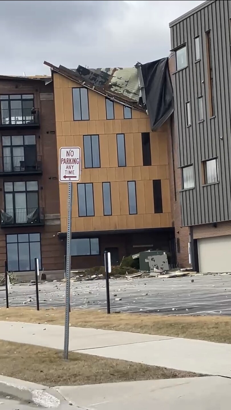Damage to the roof of a building off 8th St. 