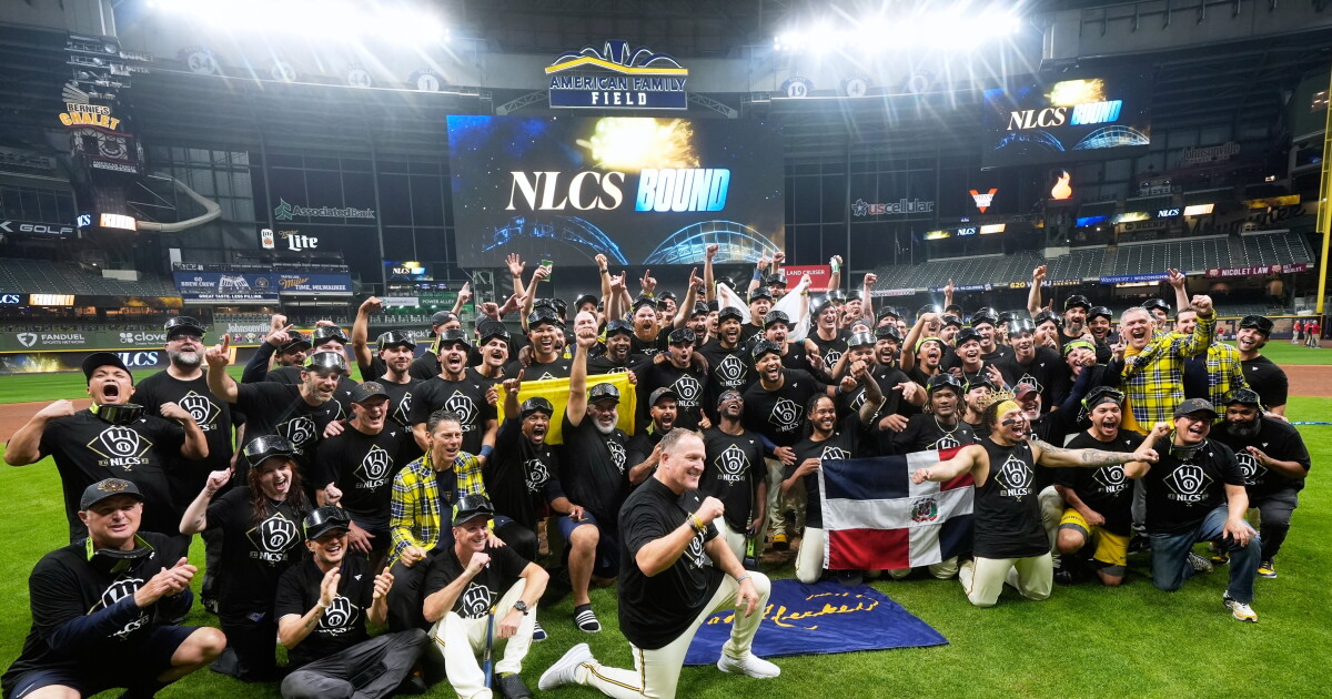 Brewers postseason celebration — archival image Milwaukee Brewers players and staff celebrate an earlier postseason milestone at American Family Field; archival celebration photo