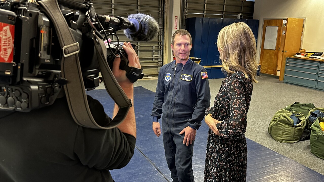 News5's Dianne Derby interviewing Wings of Blue Coach Air Force Lt. Col Jarrod Aranda