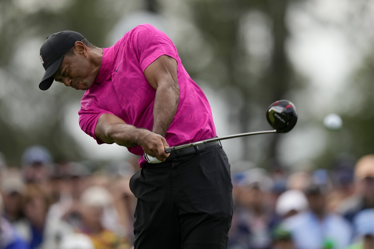 Tiger Woods tees off on first hole during first round of 2022 Masters