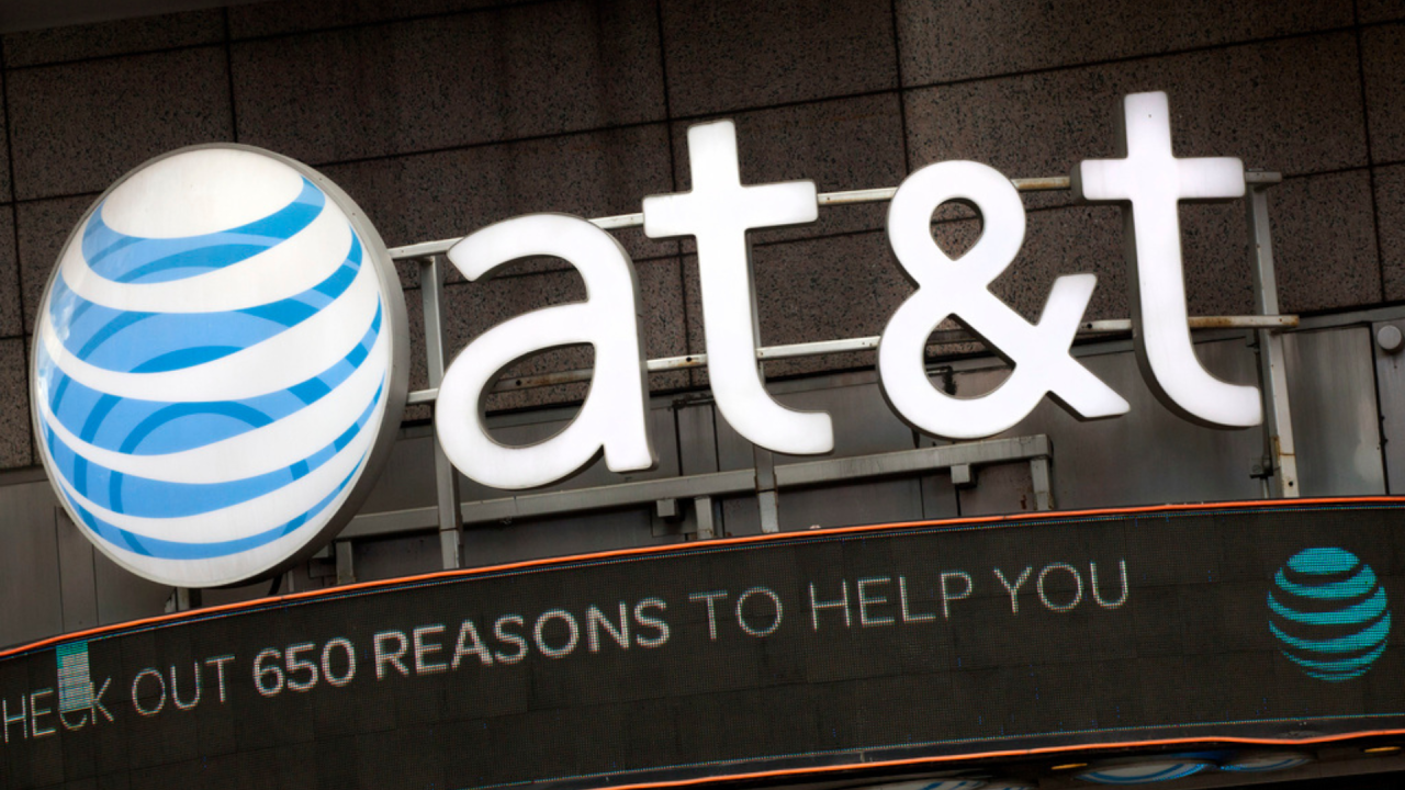 The AT&T logo is positioned above one of its retail stores