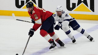 Florida Panthers center Aleksander Barkov (16) and Tampa Bay Lightning right wing Mitchell Chaffee (41) go after the puck during the third period in Game 4 of an NHL hockey Stanley Cup first-round playoff series, Monday, April 28, 2025, in Sunrise, Fla. 