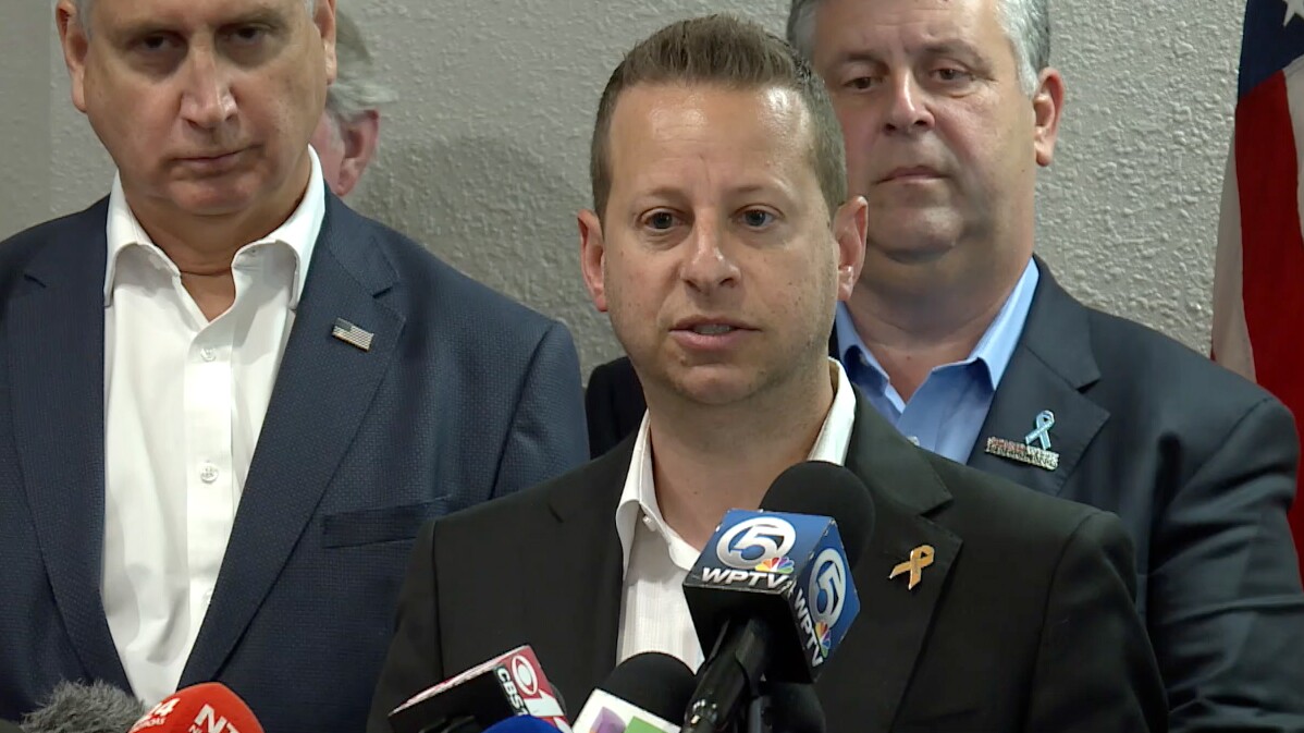 U.S. Rep. Jared Moskowitz speaks at a news conference with Parkland parents and other lawmakers after touring the school where the deadly shooting occurred in 2018.