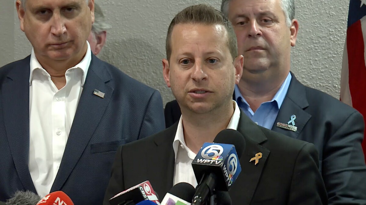 U.S. Rep. Jared Moskowitz speaks at a news conference with Parkland parents and other lawmakers after touring the school where the deadly shooting occurred in 2018. 