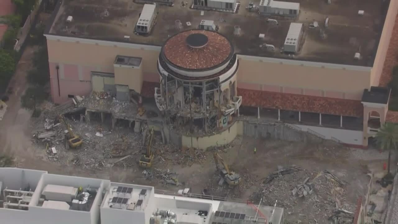 3 CAT excavators seen at demolition of former movie theater at The Square, Sept. 28, 2023