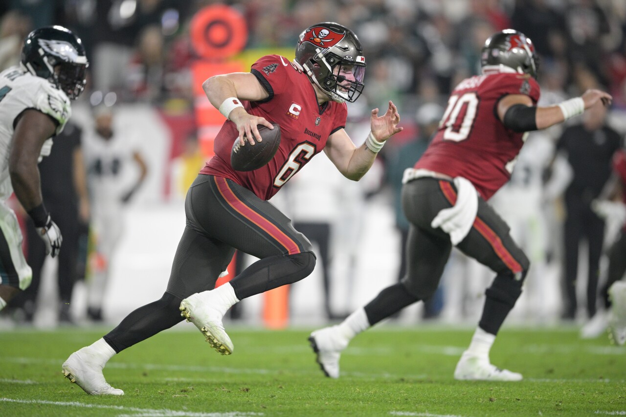 Tampa Bay Buccaneers QB Baker Mayfield scrambles from Philadelphia Eagles in first half of wild-card playoff, Jan. 15, 2024