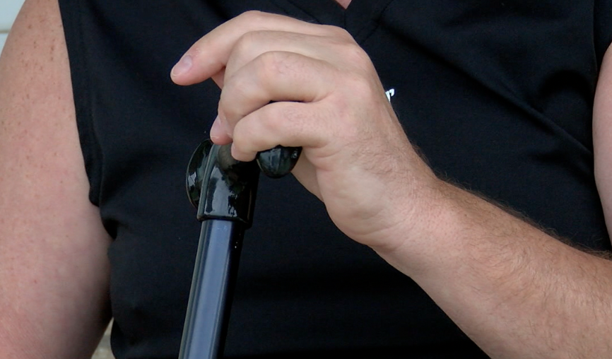 Bevilacqua using his cane for support