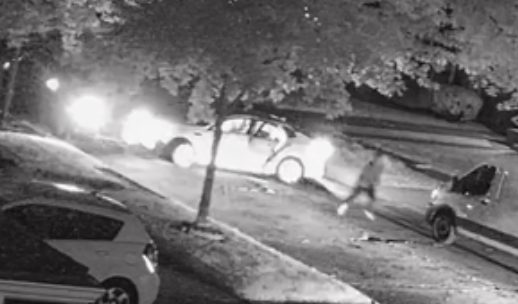 Someone hitting Mike A.'s parked vehicle near the intersection, one suspect fleeing on foot