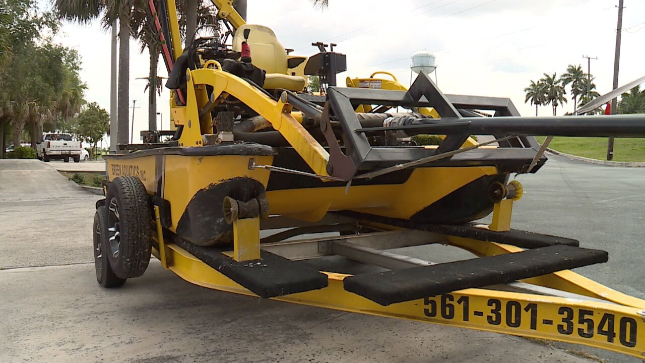 Weedoo workboat used to cleanup algae at Pahokee Marina