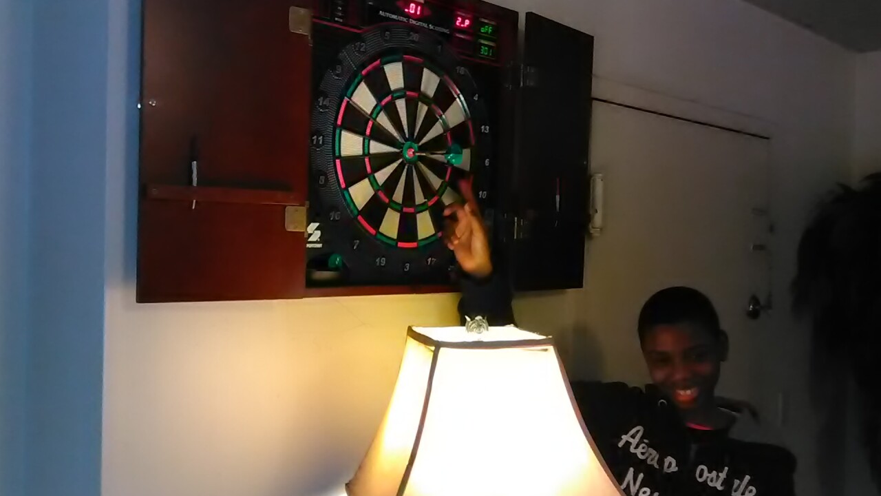 Eubanks_son_with_dart_board.jpeg