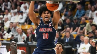 Arizona forward Koa Peat reacts as he dunks the ball for a basket against Colorado in the first half of an NCAA college basketball game Saturday, March 7, 2026, in Boulder, Colo. (AP Photo/David Zalubowski)