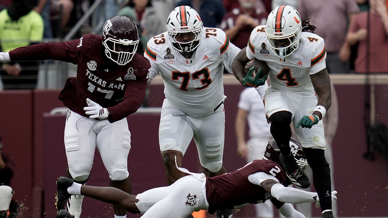 Miami running back Mark Fletcher Jr. (4) steps out of a tackle attempt by Texas A&M cornerback Dezz Ricks (2) during the second quarter in the first round of the NCAA College Football Playoff Saturday, Dec. 20, 2025, in College Station, Texas. 