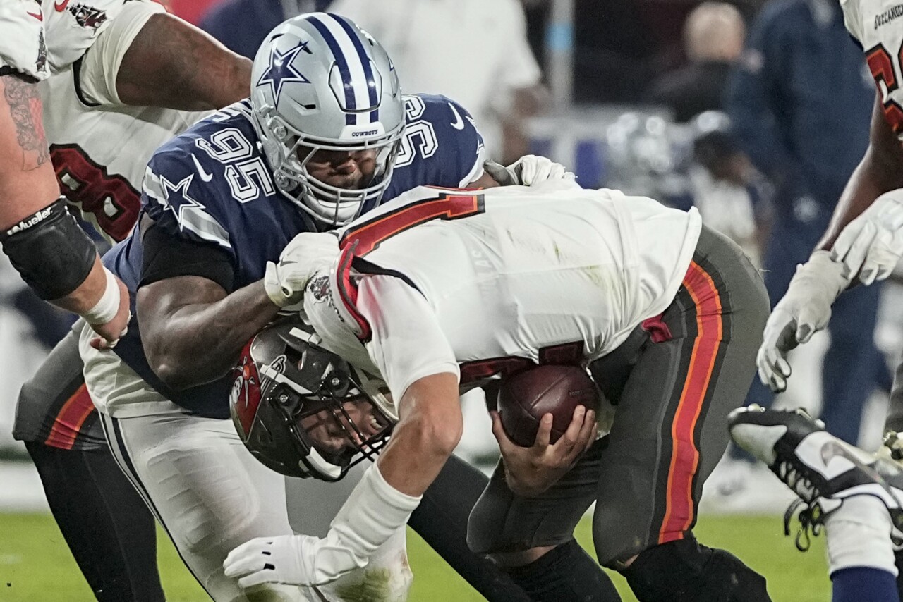 Dallas Cowboys defensive tackle Johnathan Hankins sacks Tampa Bay Buccaneers QB Tom Brady in wild-card playoff game, Jan. 16, 2023