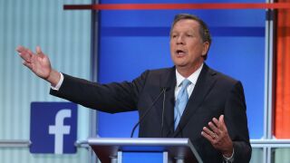 Republican presidential candidate John Kasich fields a question during the first Republican presidential debate.