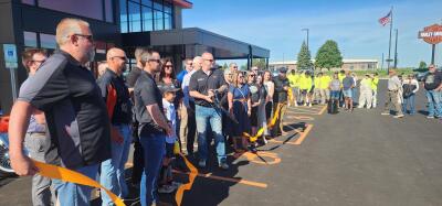 Appleton Harley Davidson employees cut the ribbon on their expanded location